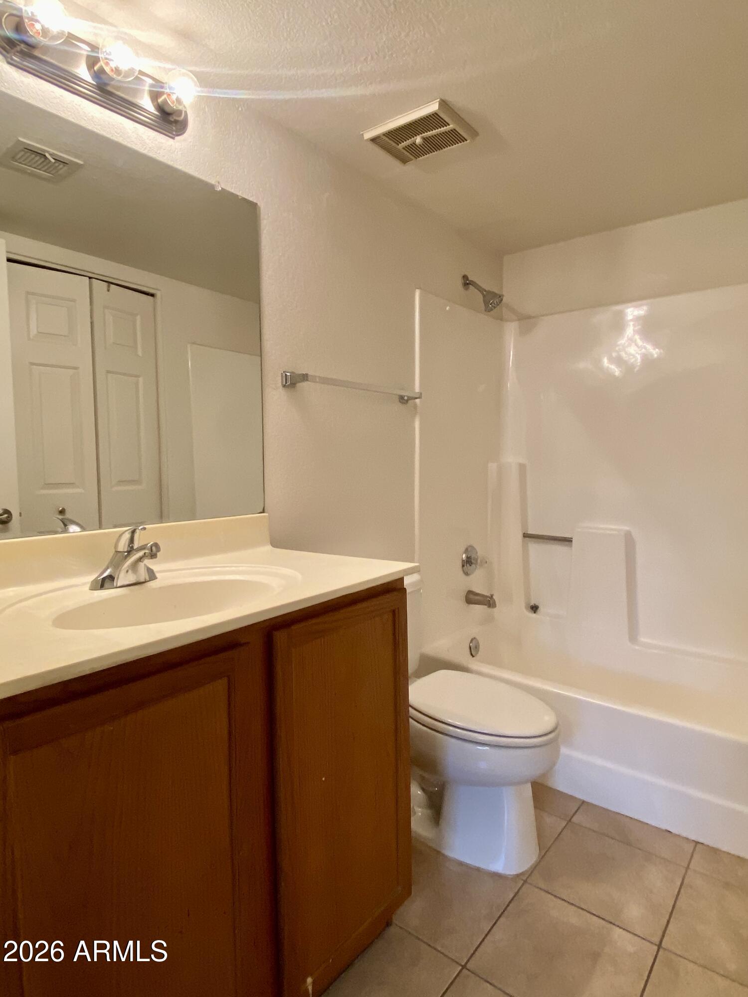 1720 East Thunderbird Road, Unit 1100 Phoenix, AZ 85022 - Photo 10 of 34 a bathroom with a sink toilet and shower