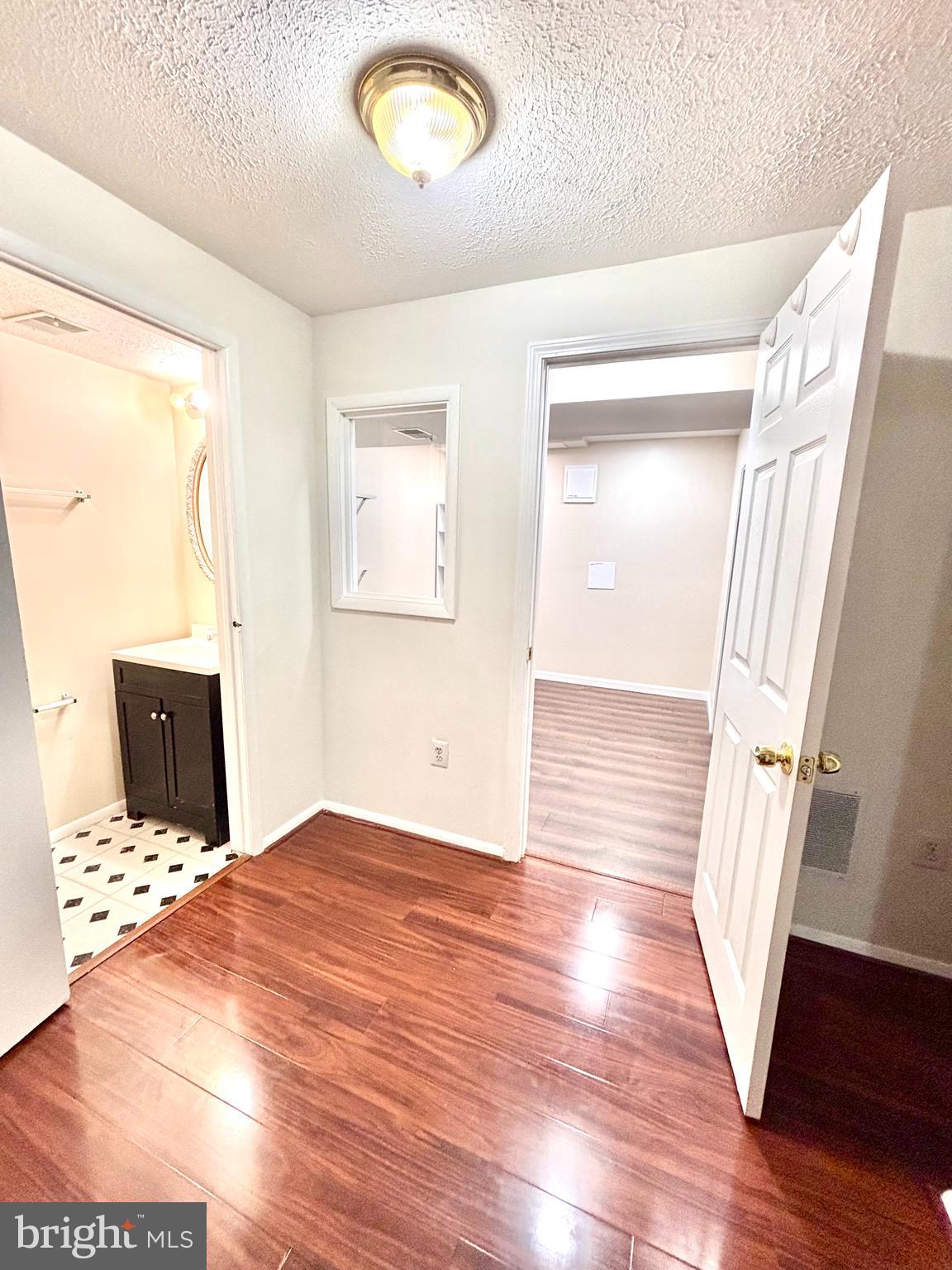 6226 Hillside Road Springfield, VA 22152 - Photo 29 of 37 a view of a room with wooden floor and stairs