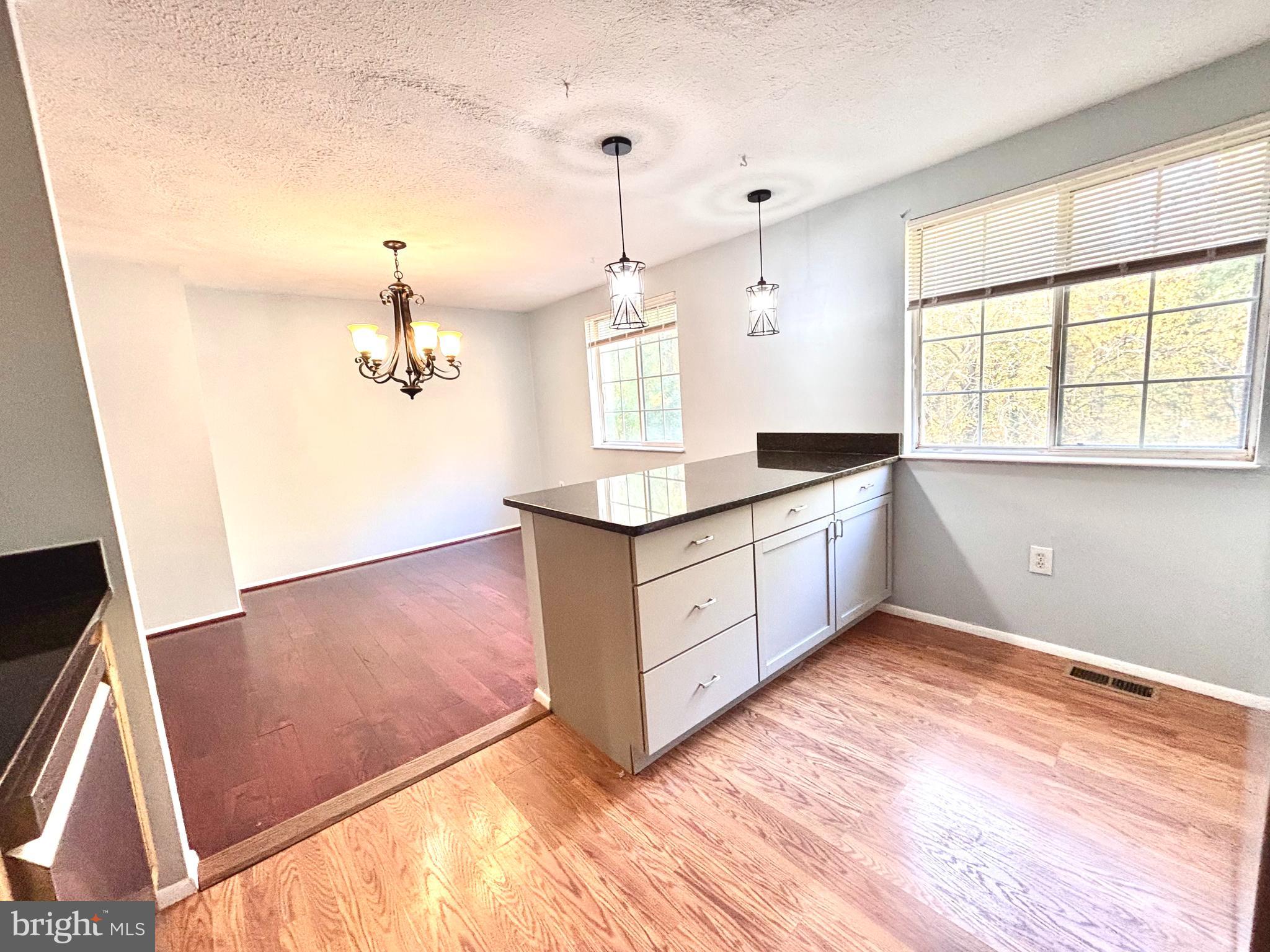 6226 Hillside Road Springfield, VA 22152 - Photo 8 of 37 a kitchen with granite countertop a stove a sink and a window