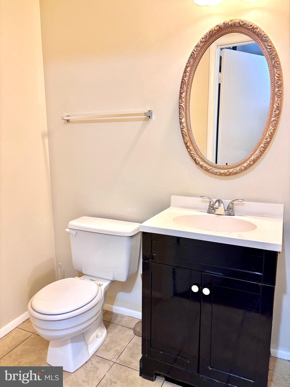 6226 Hillside Road Springfield, VA 22152 - Photo 10 of 37 a bathroom with a sink mirror vanity and toilet