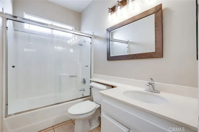 a view of wooden floor and windows in a room