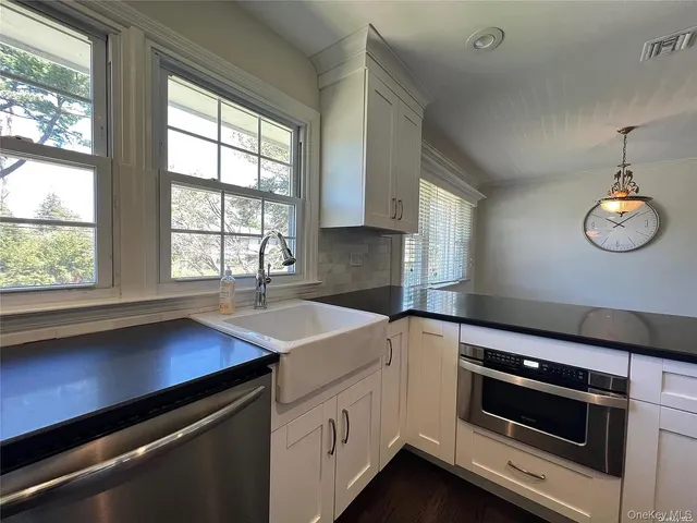 a kitchen that has a stove and a sink