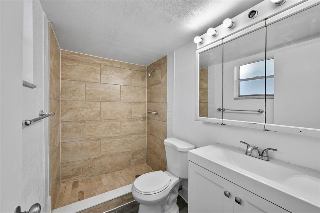 7541 Northwest 16th Street, Unit 1211 Plantation, FL 33313 - Photo 11 of 23 a bathroom with a sink a toilet and shower
