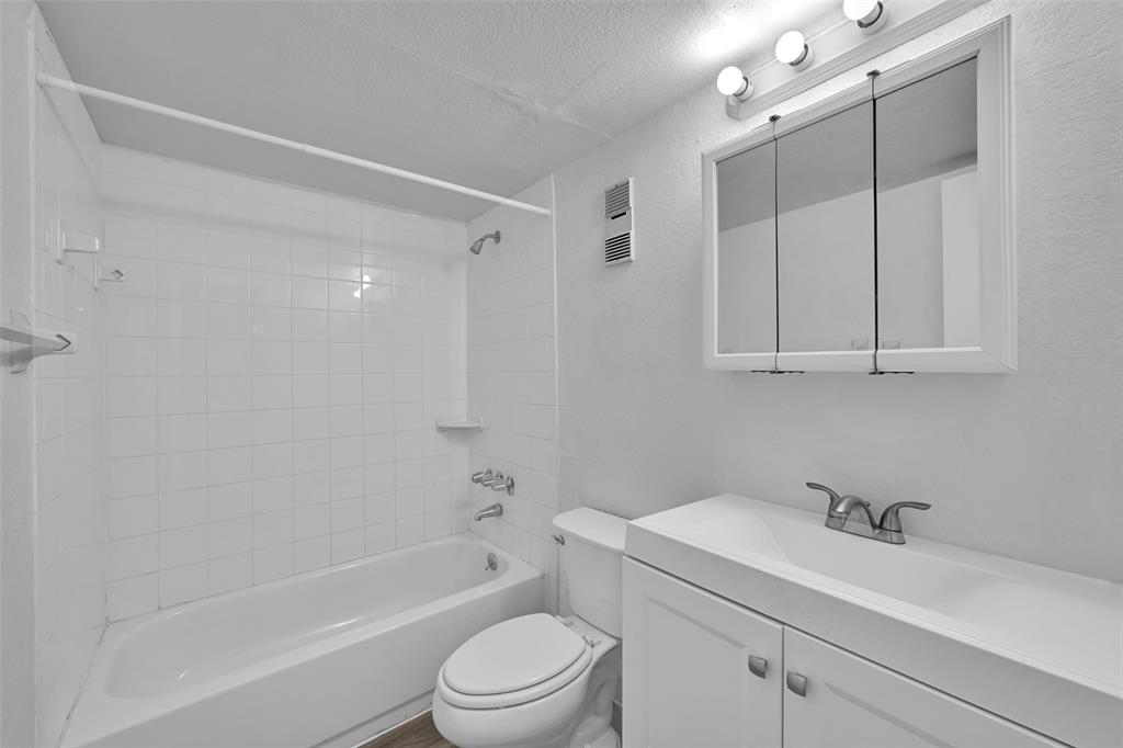 7541 Northwest 16th Street, Unit 1211 Plantation, FL 33313 - Photo 13 of 23 a bathroom with a sink a toilet and shower