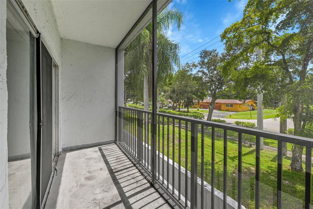 7541 Northwest 16th Street, Unit 1211 Plantation, FL 33313 - Photo 17 of 23 a view of a balcony with outdoor space