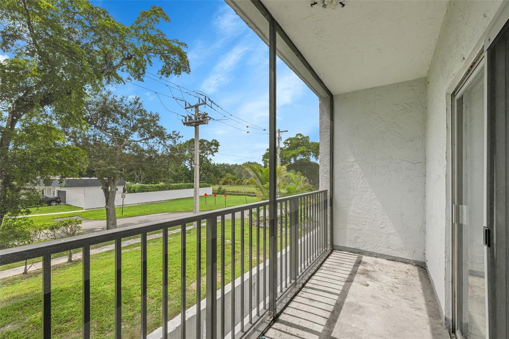 7541 Northwest 16th Street, Unit 1211 Plantation, FL 33313 - Photo 18 of 23 a view of balcony and yard