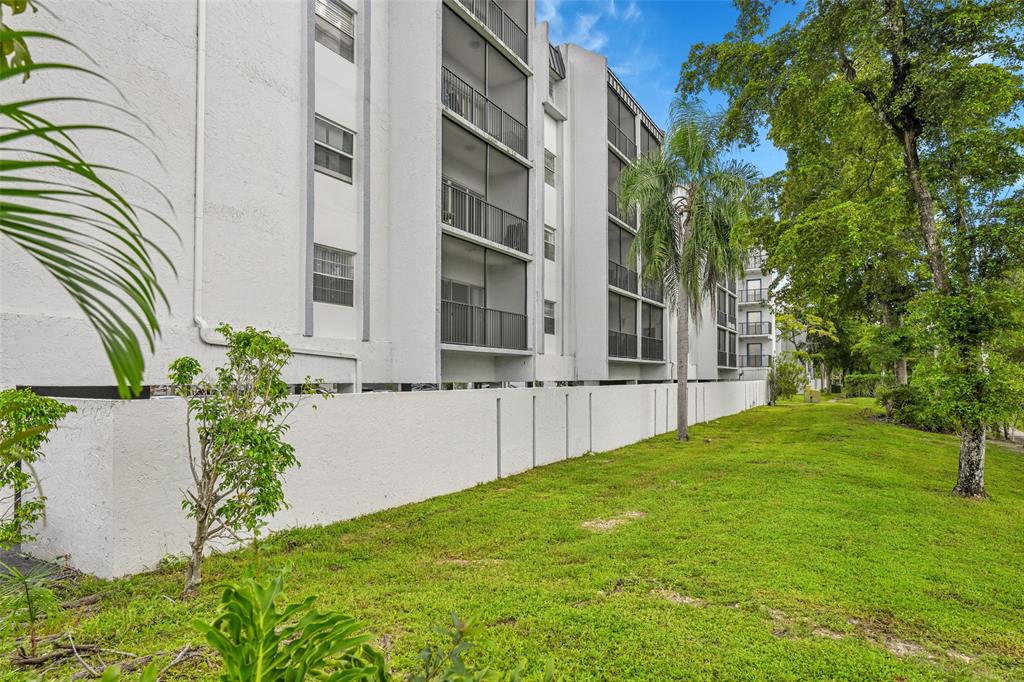 7541 Northwest 16th Street, Unit 1211 Plantation, FL 33313 - Photo 20 of 23 a view of an house with backyard and garden