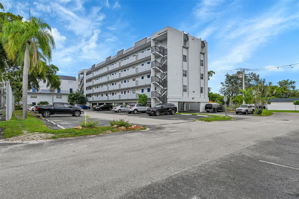7541 Northwest 16th Street, Unit 1211 Plantation, FL 33313 - Photo 21 of 23 a view of a tall building next to a road