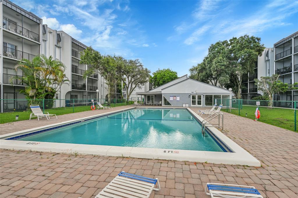 7541 Northwest 16th Street, Unit 1211 Plantation, FL 33313 - Photo 23 of 23 a view of swimming pool with a yard