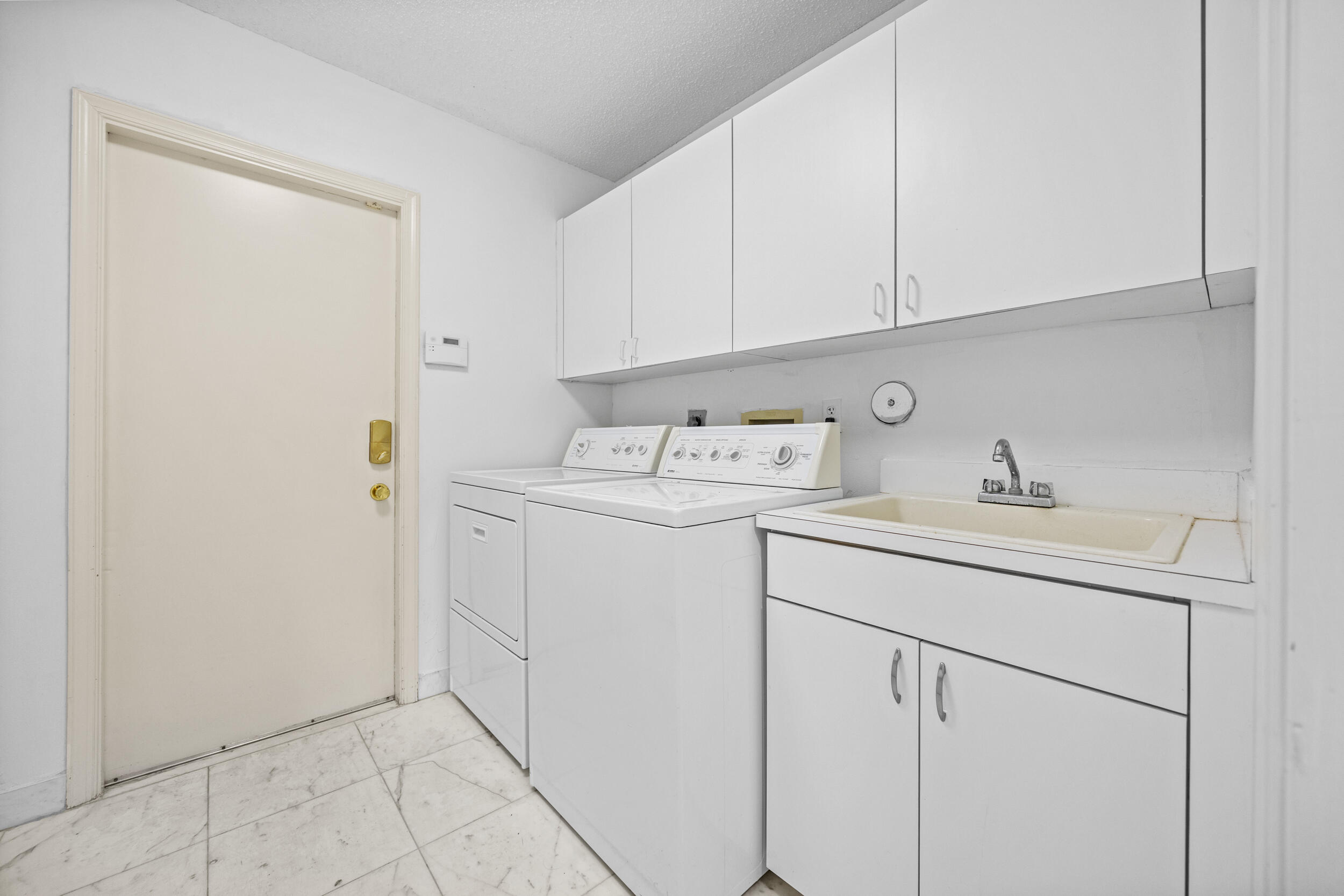 10747 Stonebridge Boulevard Boca Raton, FL 33498 - Photo 44 of 75 a utility room with dryer and washer