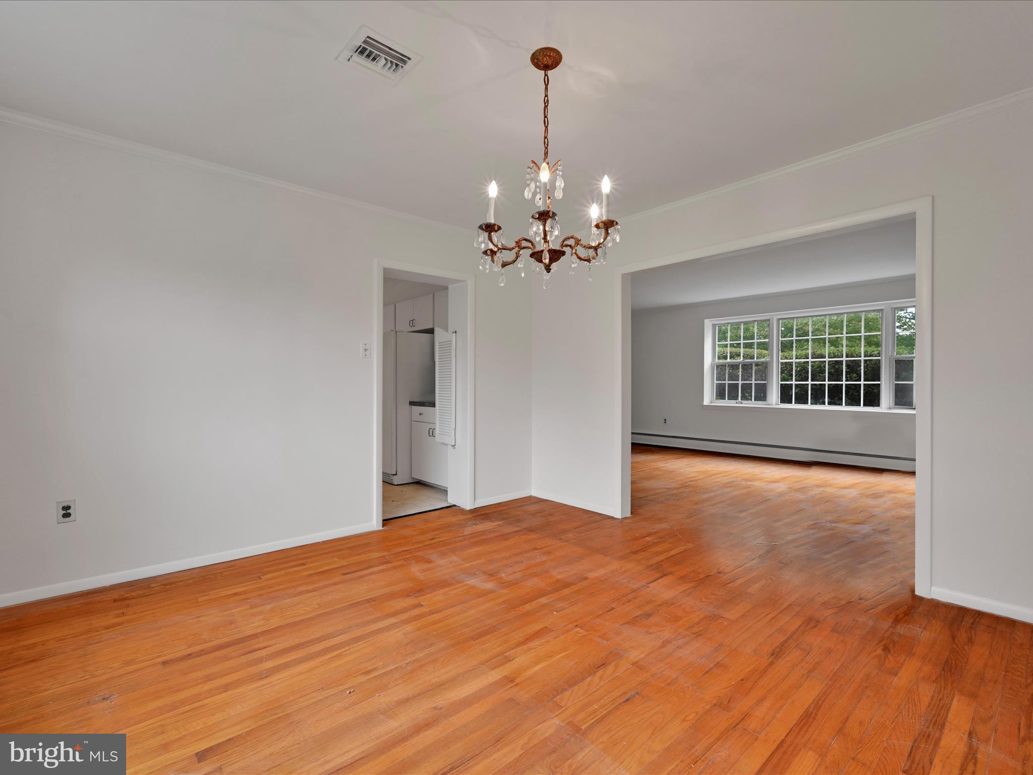 14 Stone Ridge Road Thornton, PA 19373 - Photo 12 of 45 a view of an empty room with wooden floor and a window