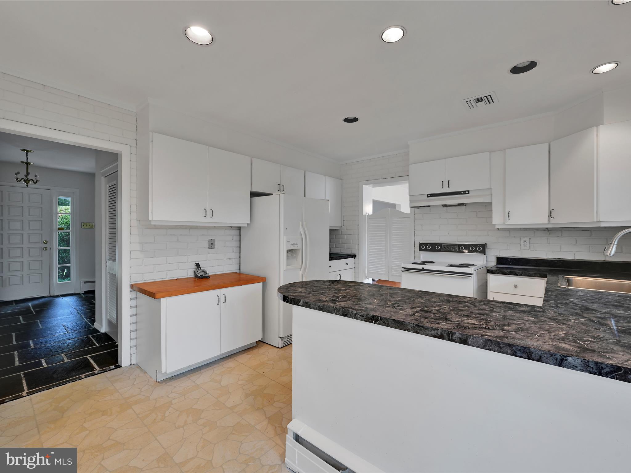 14 Stone Ridge Road Thornton, PA 19373 - Photo 15 of 45 a kitchen with white cabinets and a sink