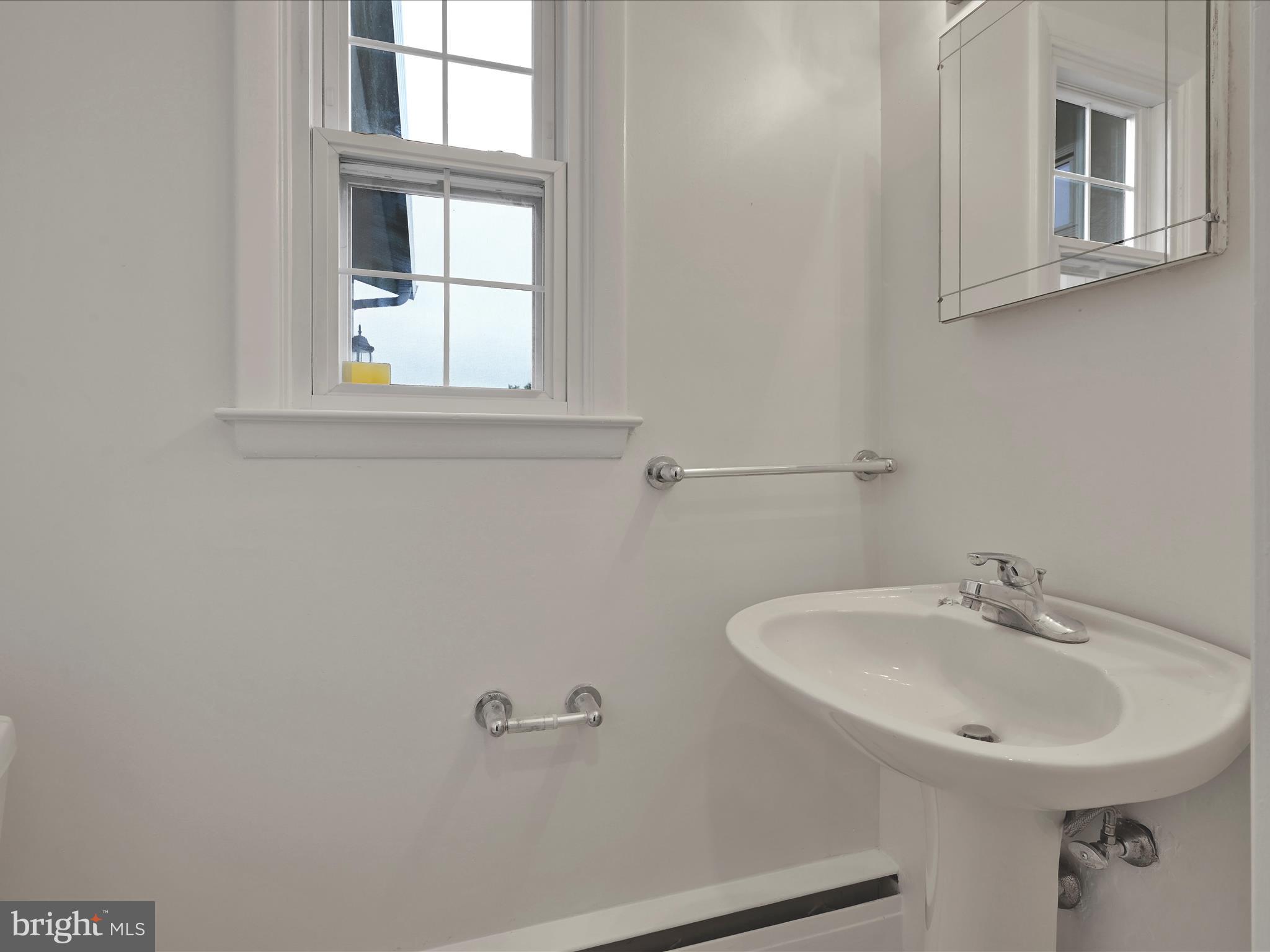 14 Stone Ridge Road Thornton, PA 19373 - Photo 19 of 45 a bathroom with a sink and a mirror