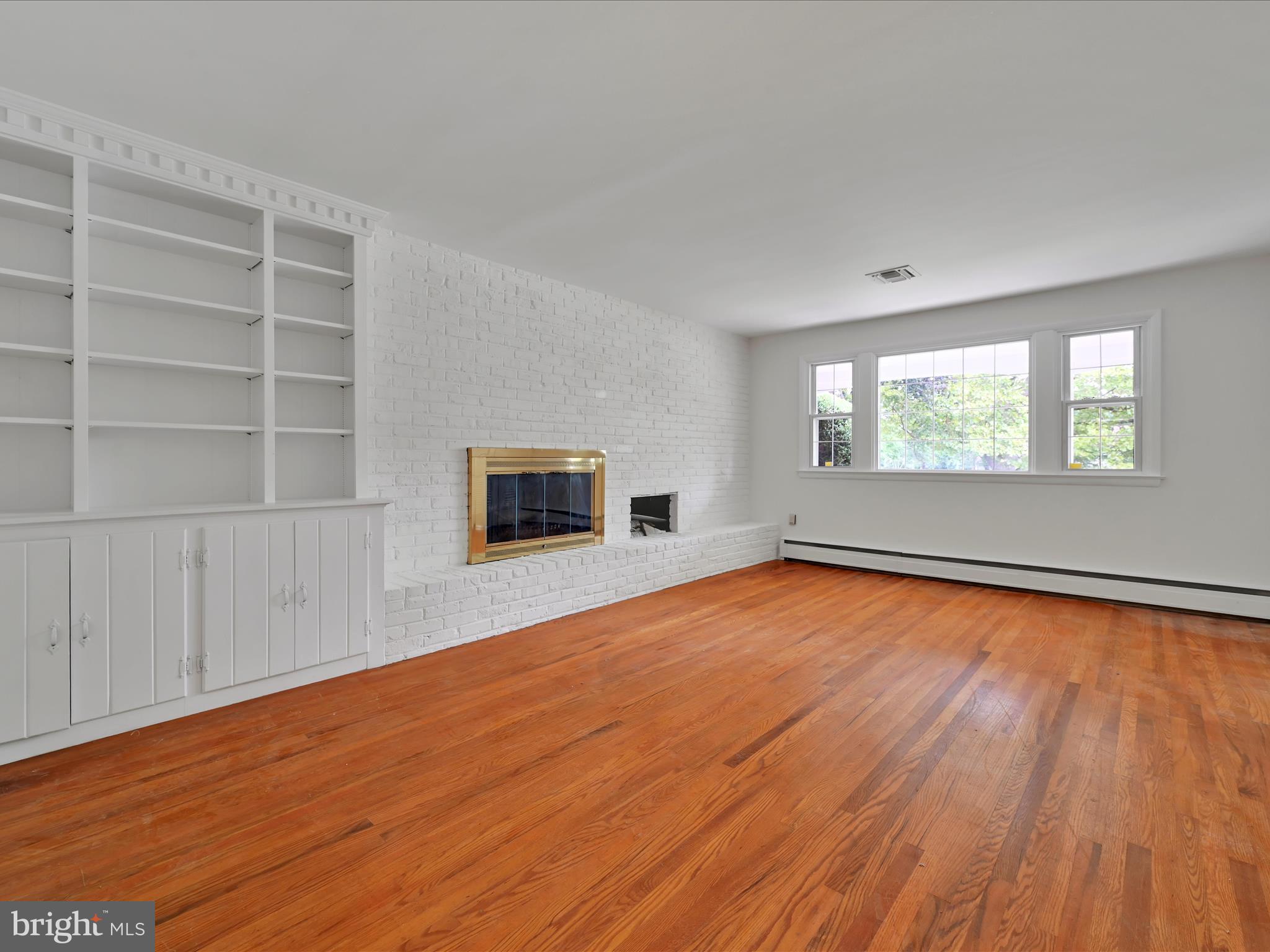 14 Stone Ridge Road Thornton, PA 19373 - Photo 22 of 45 an empty room with wooden floor and windows