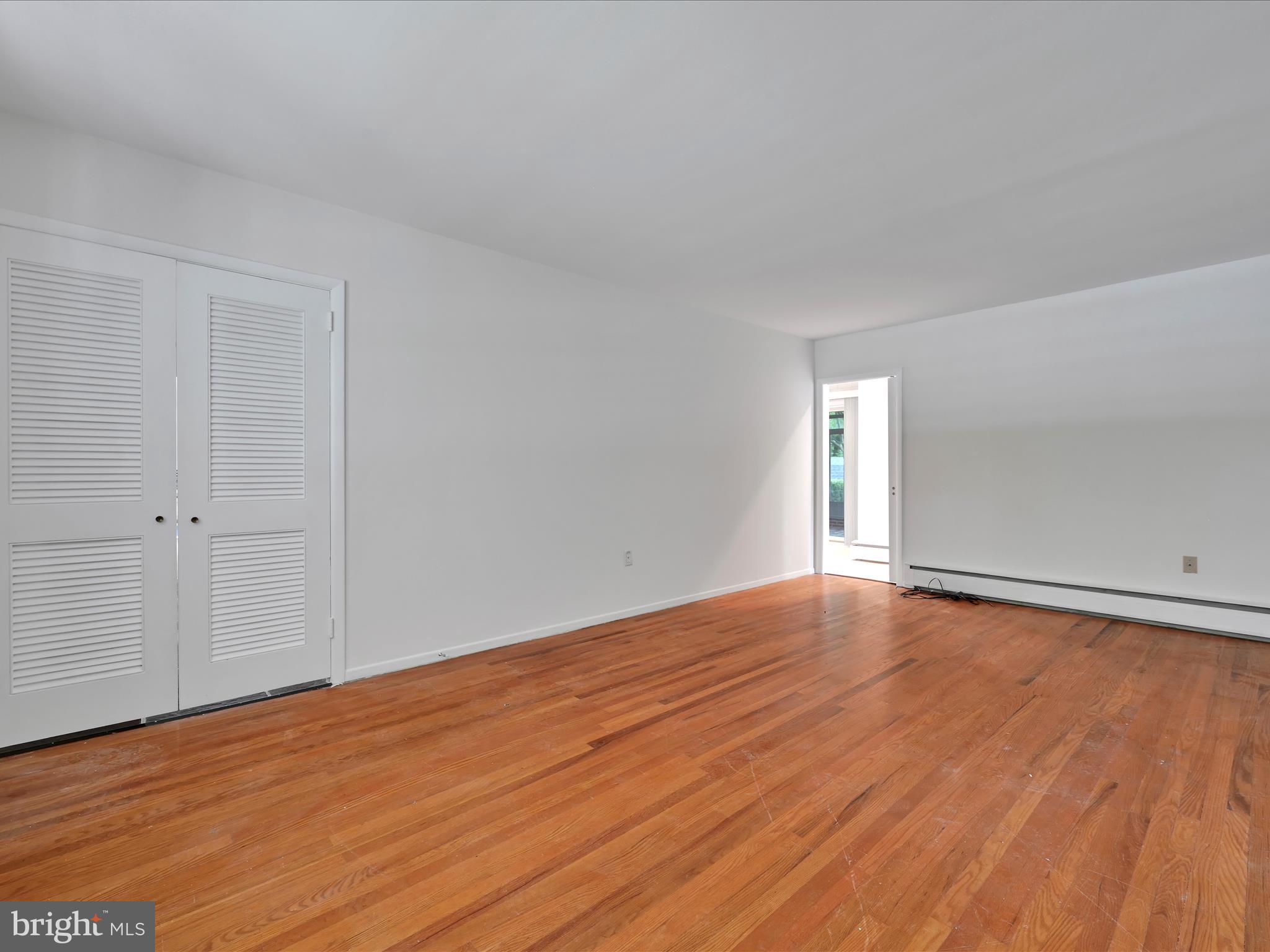 14 Stone Ridge Road Thornton, PA 19373 - Photo 23 of 45 a view of an empty room and wooden floor