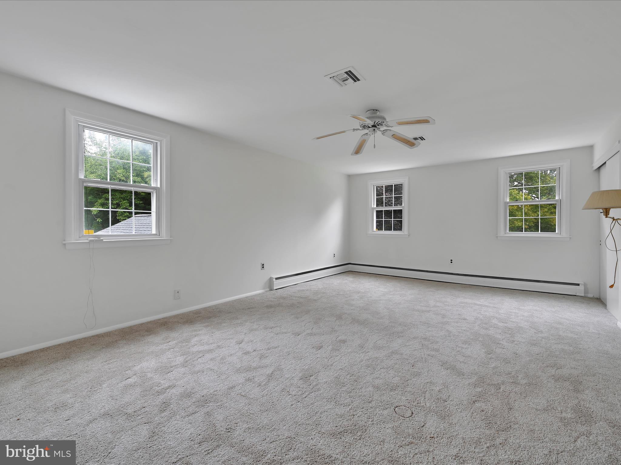 14 Stone Ridge Road Thornton, PA 19373 - Photo 24 of 45 an empty room with windows and ceiling fan
