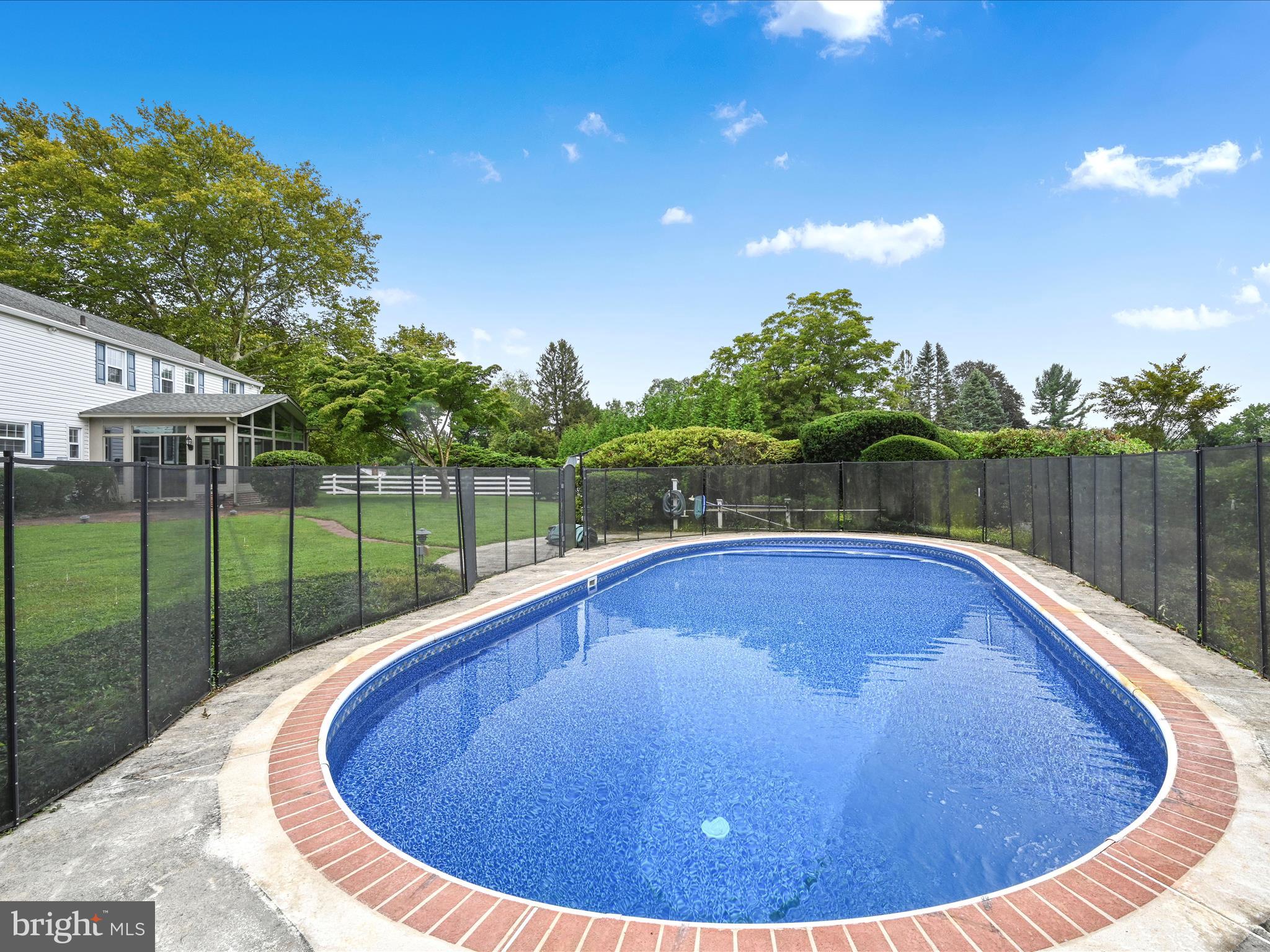 14 Stone Ridge Road Thornton, PA 19373 - Photo 37 of 45 a view of a swimming pool with a patio