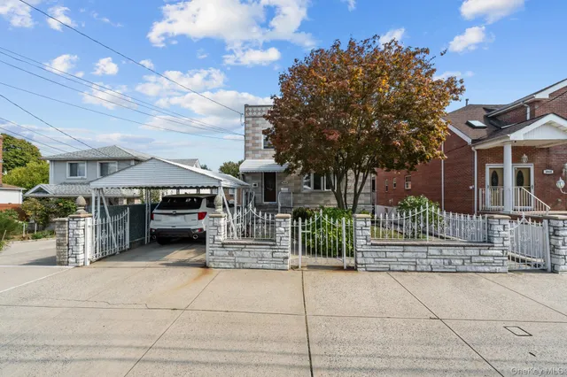 a view of a house with a iron gate