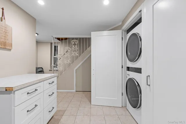 a view of a storage and utility room with washer and dryer