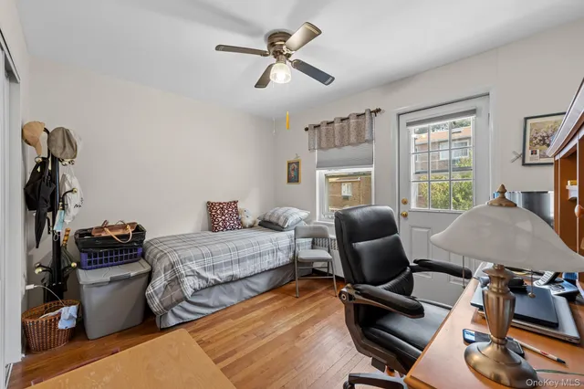 a bedroom with furniture and a window