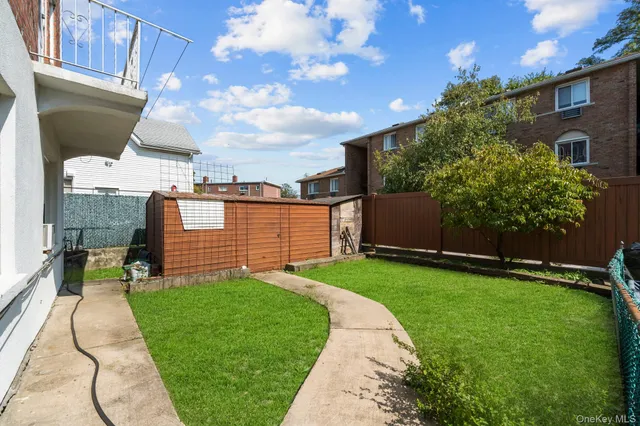 a view of a backyard of the house
