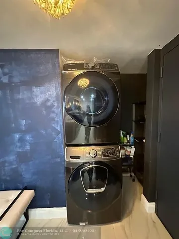 a stove top oven sitting inside of a kitchen