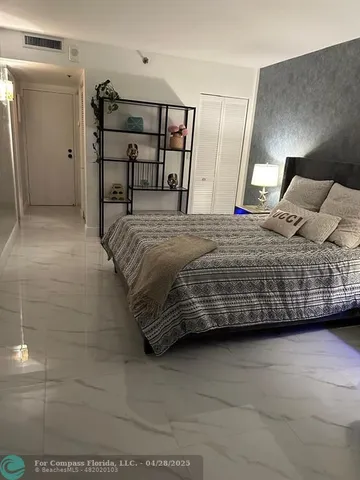 a bedroom with a bed and a table