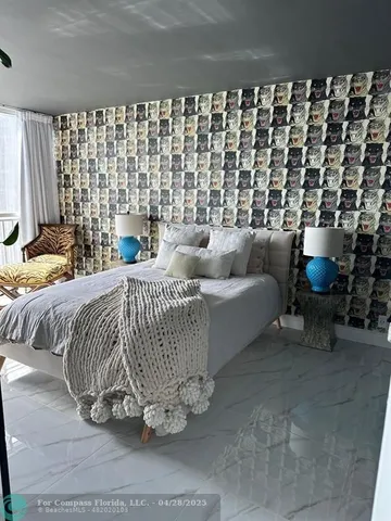 a bedroom with a bed and a couch