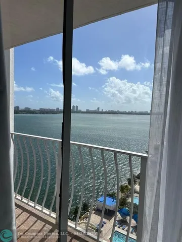 a view of a balcony with lake view and mountain view
