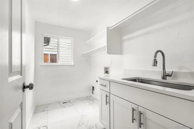 a kitchen with a sink and a window