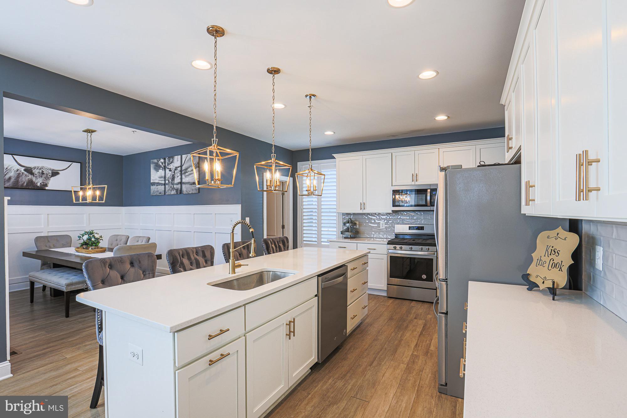 809 Jefferson Pike Brunswick, MD 21716 - Photo 15 of 64 a kitchen that has a lot of cabinets and wooden floor
