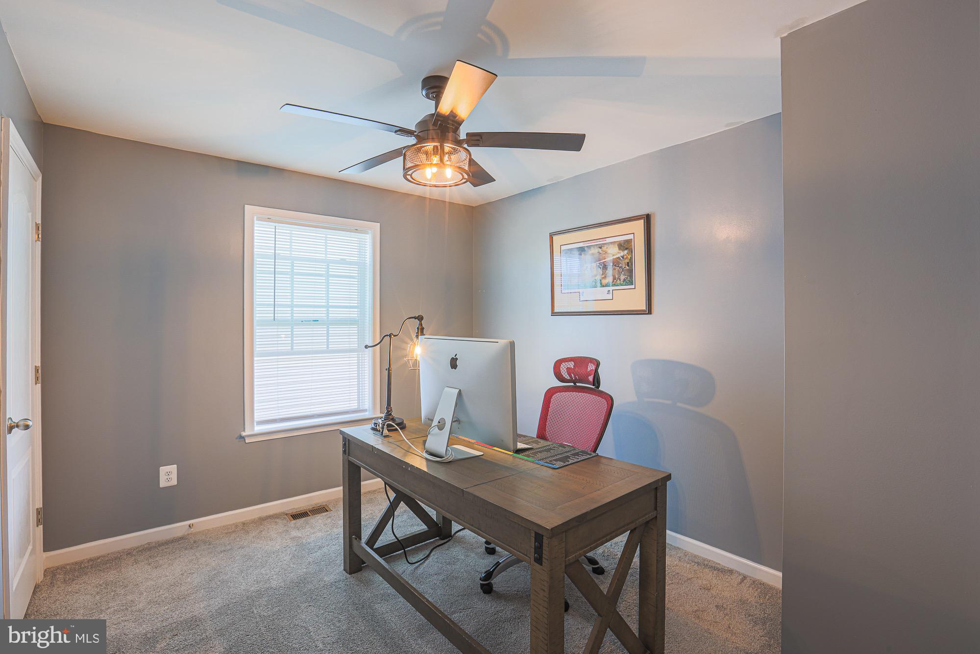 809 Jefferson Pike Brunswick, MD 21716 - Photo 34 of 64 a view of a workspace with furniture and a window