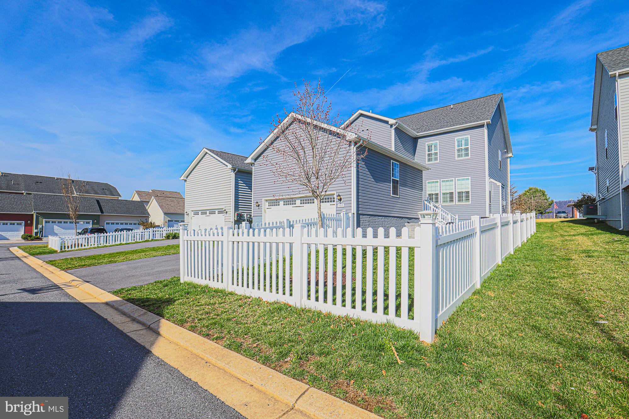 809 Jefferson Pike Brunswick, MD 21716 - Photo 4 of 64 a view of a house with a small yard and wooden fence