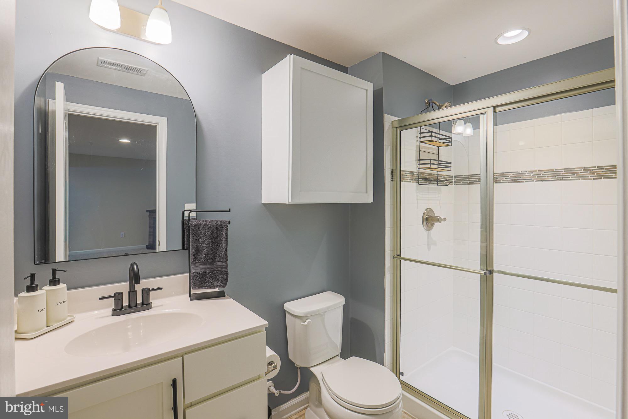 809 Jefferson Pike Brunswick, MD 21716 - Photo 46 of 64 a bathroom with a sink toilet vanity and shower