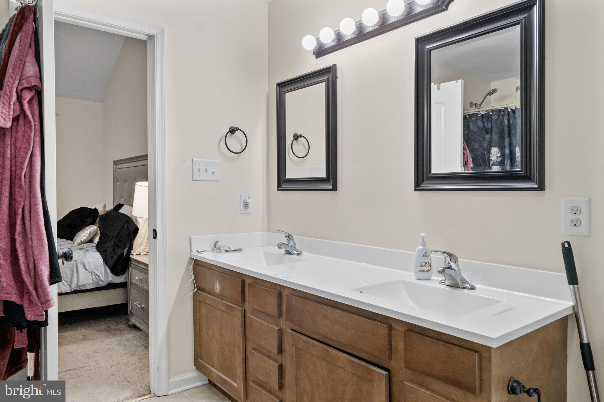 39 Baltic Court Inwood, WV 25428 - Photo 13 of 17 a en suite bathroom with a double vanity sink and a mirror