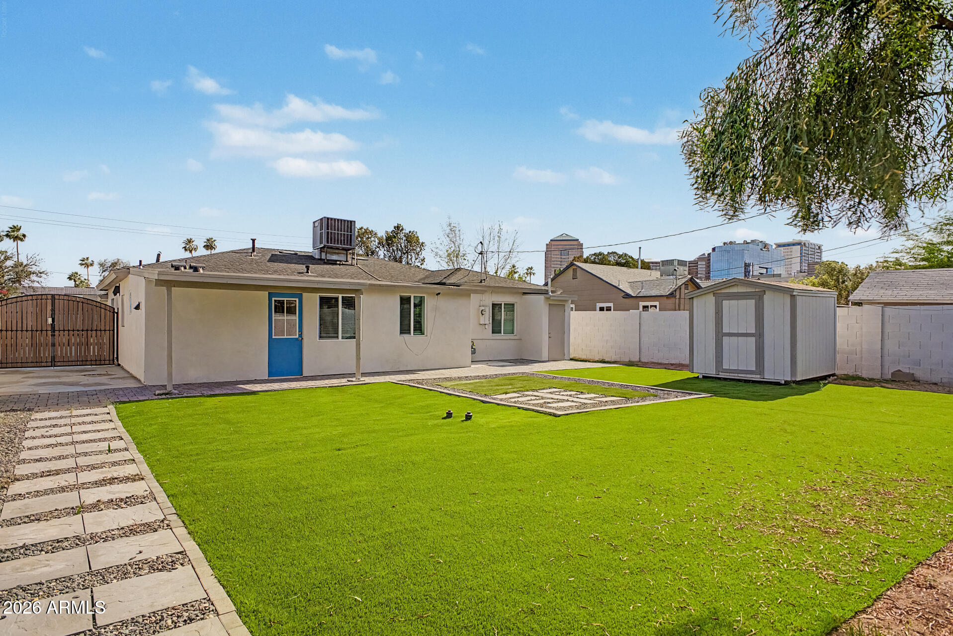 532 East Cheery Lynn Road Phoenix, AZ 85014 - Photo 37 of 37 a view of a house with swimming pool and a yard