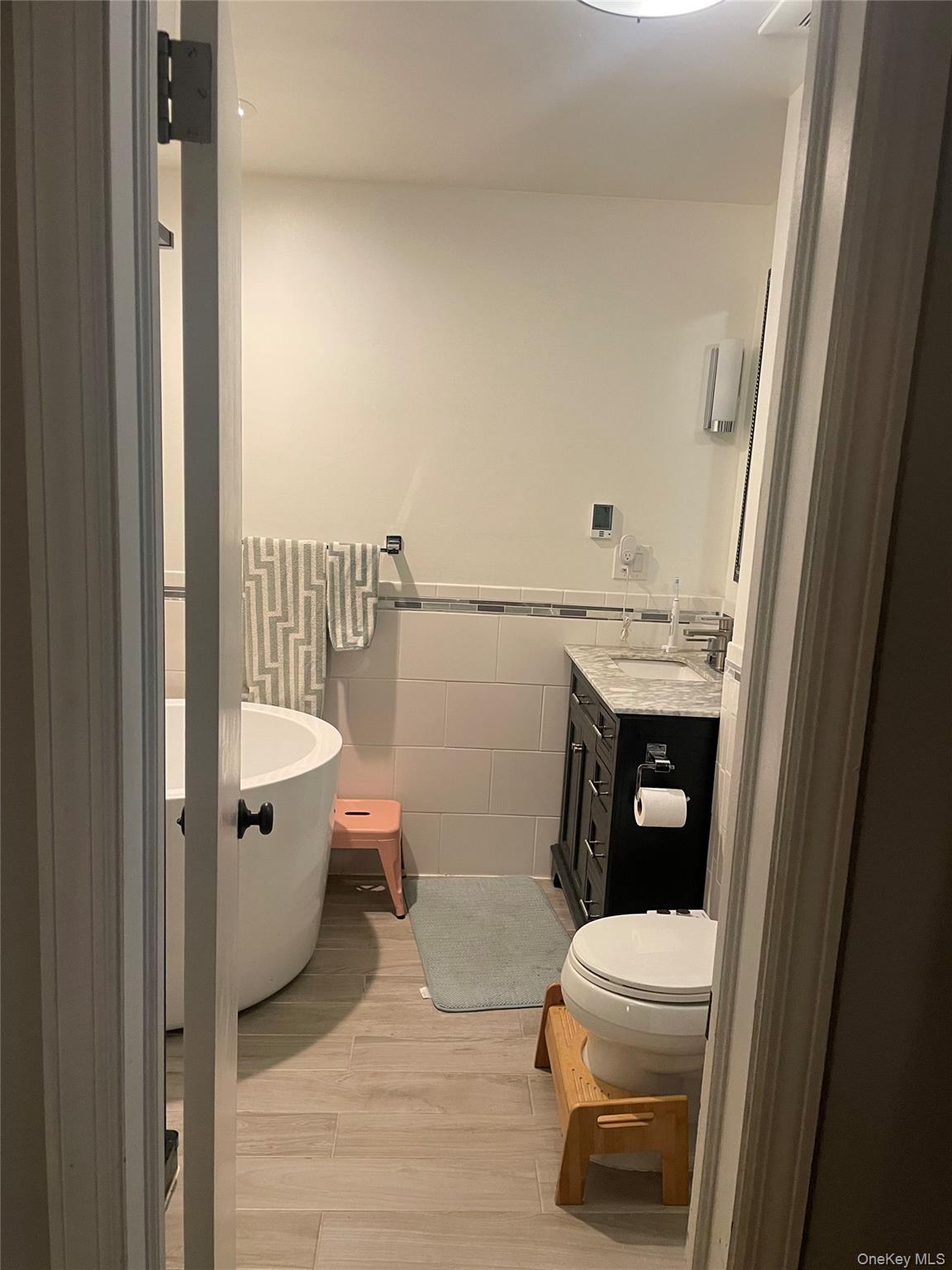 291 North Little Tor Road New City, NY 10956 - Photo 15 of 25 a white toilet sitting next to a bathroom sink