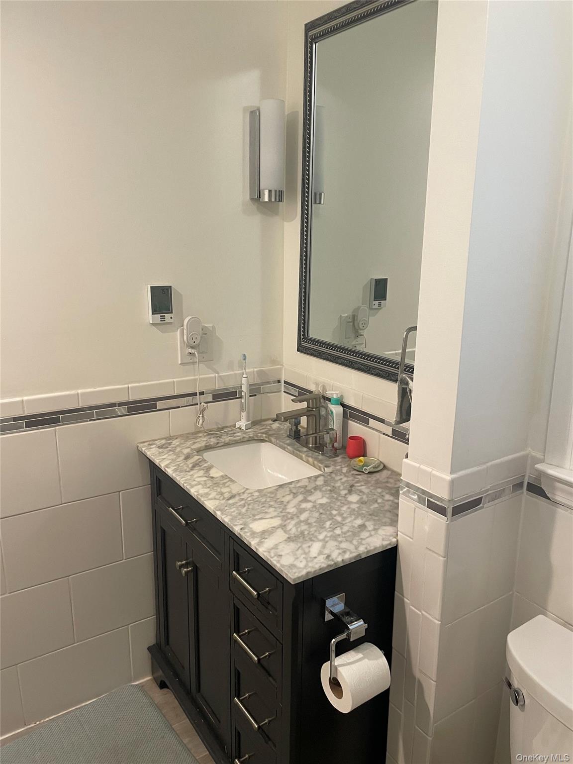 291 North Little Tor Road New City, NY 10956 - Photo 17 of 25 a bathroom with a granite countertop sink and a mirror