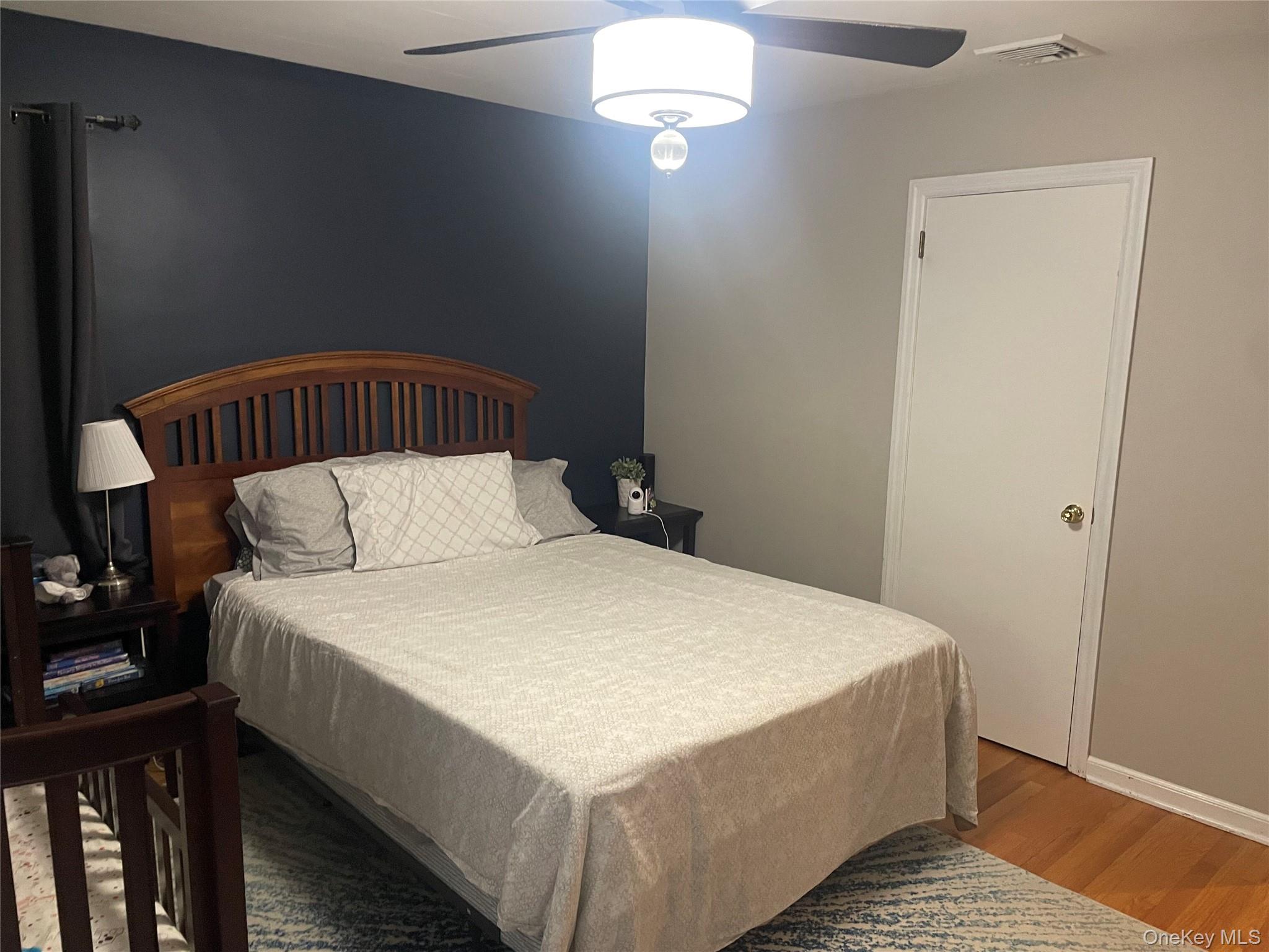 291 North Little Tor Road New City, NY 10956 - Photo 21 of 25 a bed sitting in a bedroom next to a window