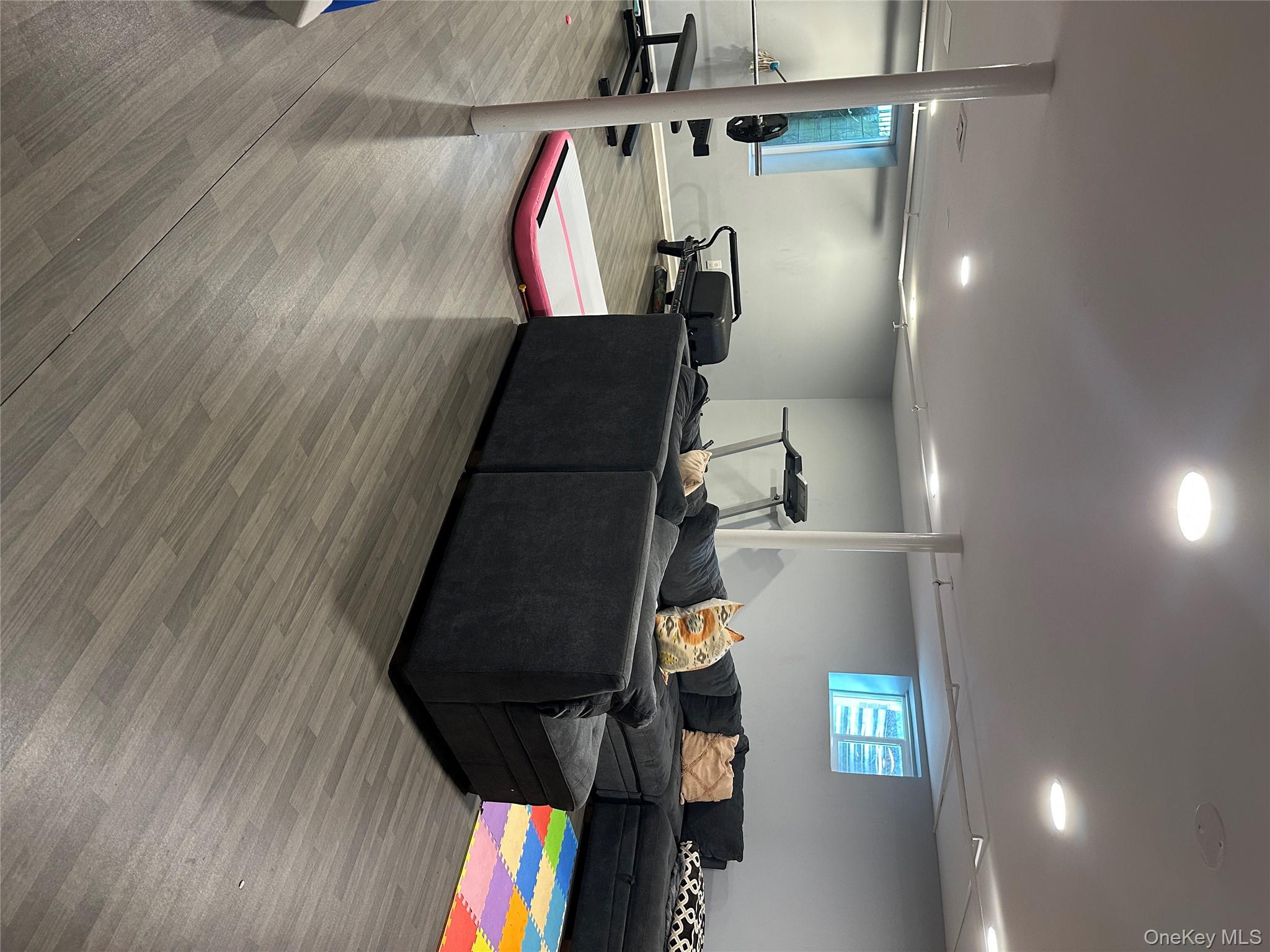 291 North Little Tor Road New City, NY 10956 - Photo 24 of 25 a living room with furniture and a flat screen tv