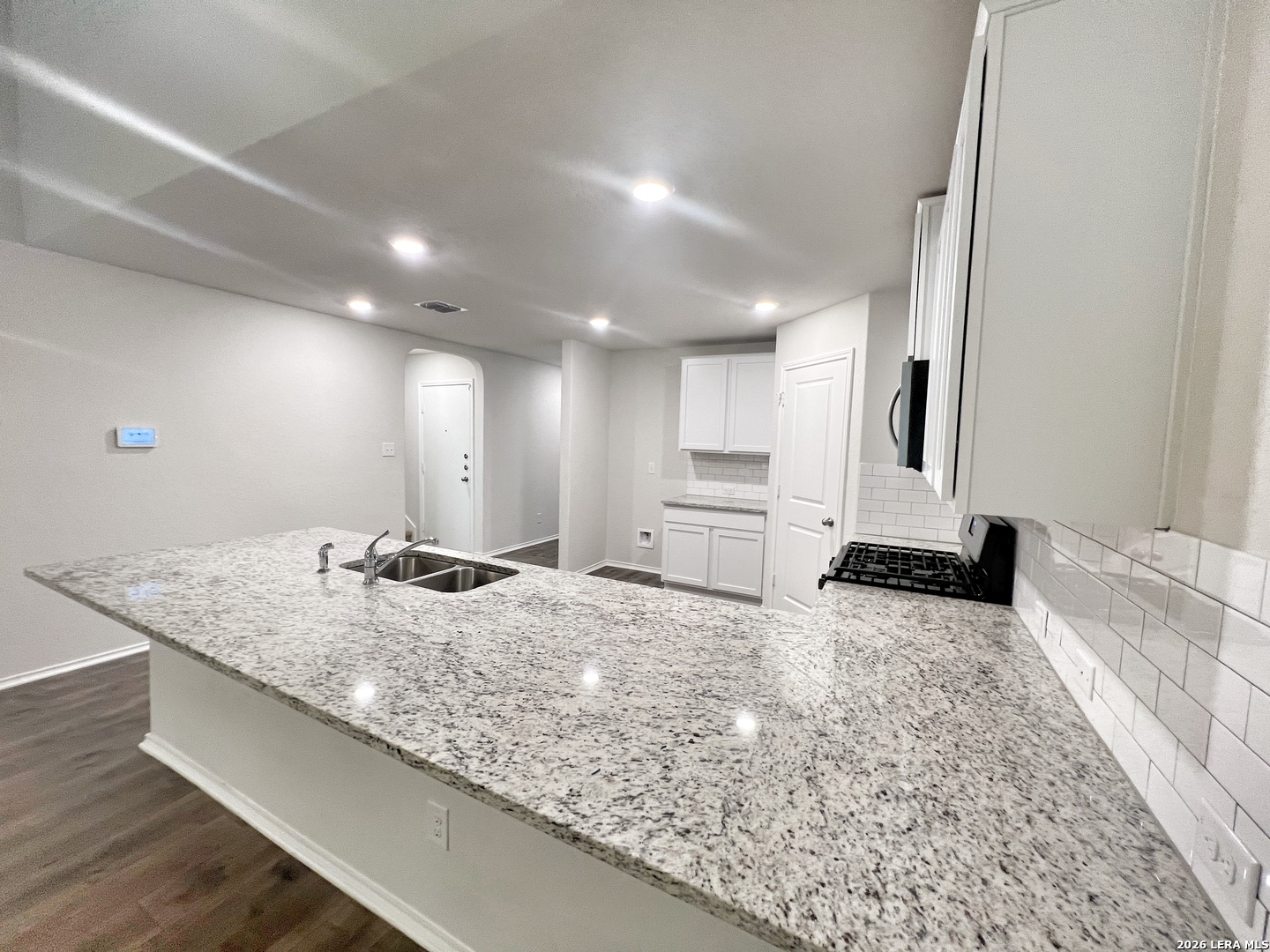 29529 Spring Copper Bulverde, TX 78163 - Photo 16 of 41 a bathroom with a granite countertop sink and a mirror