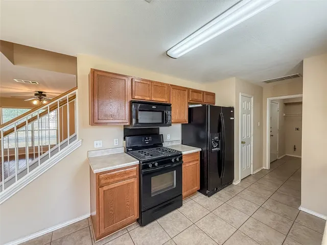 a bathroom with a tub a sink shower and mirror