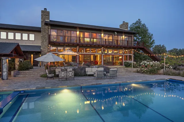 a view of a swimming pool with a patio