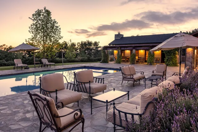 a view of swimming pool with a patio