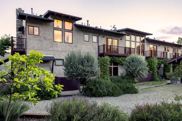 a sign that is on the side of the house