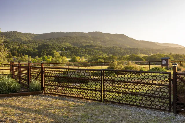 an aerial view of a house with a swimming pool
