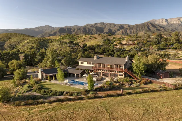 a view of swimming pool with a yard