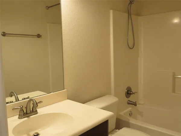 a bathroom with a sink and a bathtub