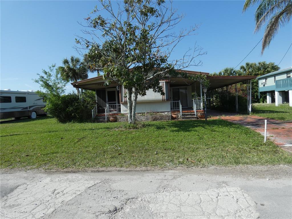 6603 Sandra Drive Port Richey, FL 34668 - Photo 1 of 1 a front view of a house with garden