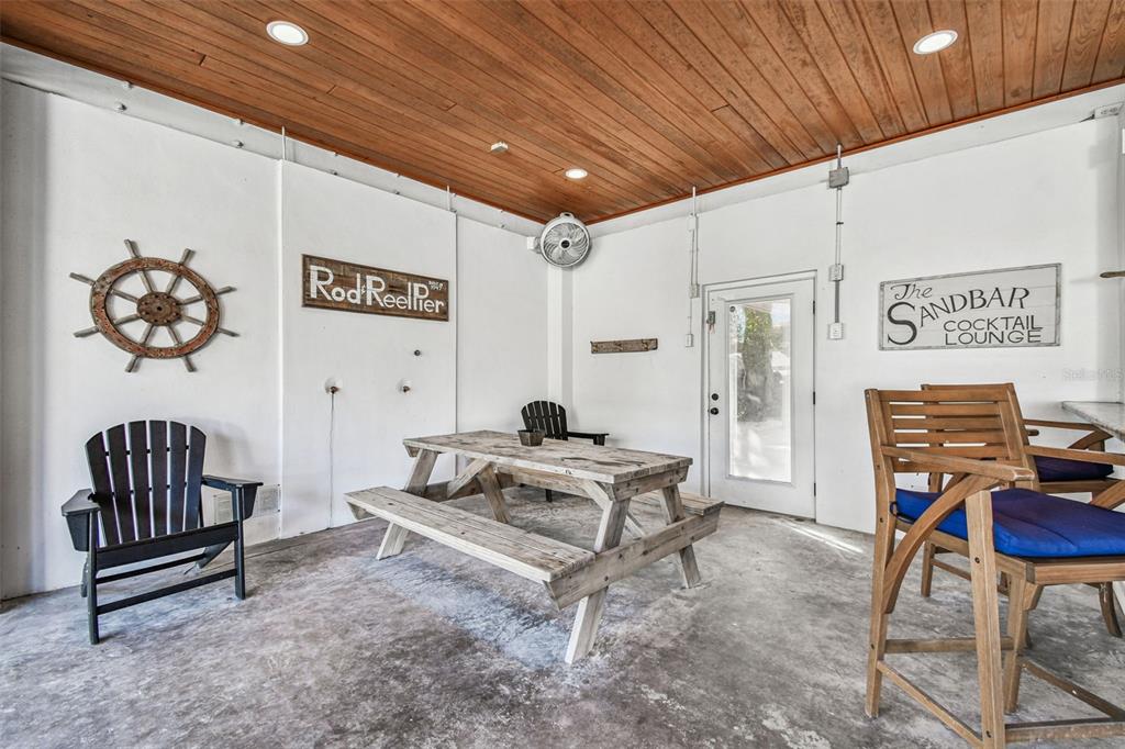 612 Fern Street Anna Maria, FL 34216 - Photo 54 of 81 a living room with furniture a piano and a projector
